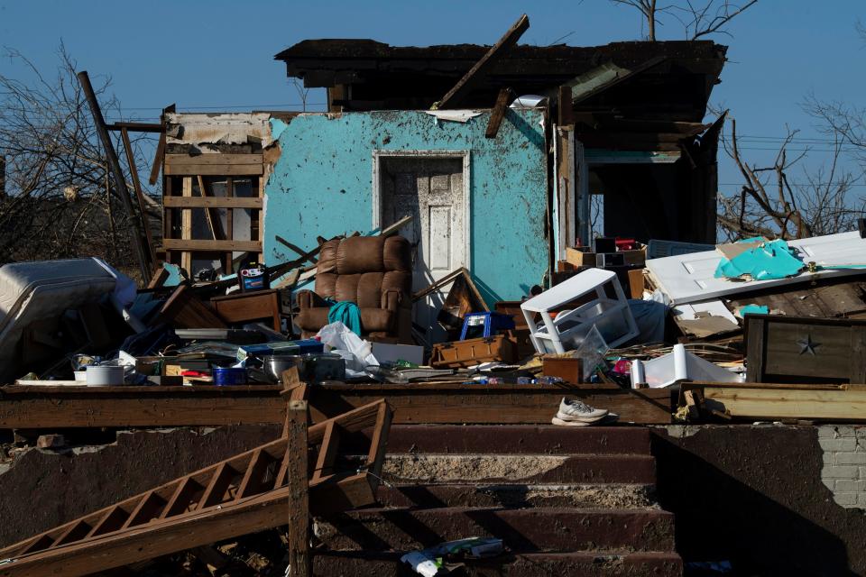 What's left of a home on N. Sixth Street in Mayfield, Ky., Dec. 23, 2021. A FEMA team was going door-to-door to meet survivors of the devastating Dec. 10 tornado in order to register them for federal financial assistance.