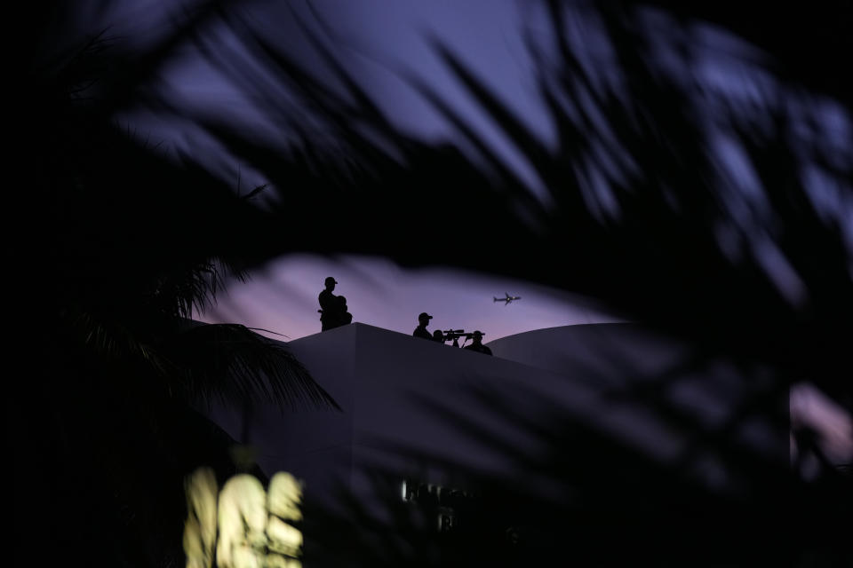 Snipers stand watch from an adjacent rooftop during an event commemorating Kristallnacht, the 1938 government-backed pogroms against Jews in Germany and Austria, at the Holocaust Memorial in Miami Beach, Fla., Sunday, Nov. 5, 2023. (AP Photo/Rebecca Blackwell)