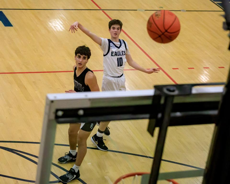 Troy Chase watches as the ball drops into the net.