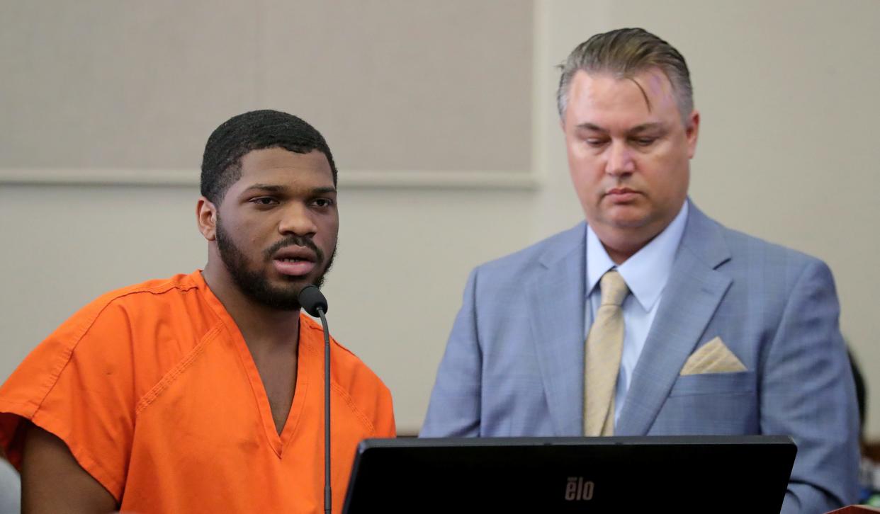 Makhi Anderson-Clay, left, who pleaded guilty to aggravated robbery, gives a statement Monday as his attorney, John Alexander, looks on in Judge Joy Malek Oldfield's courtroom at the Summit County Courthouse.