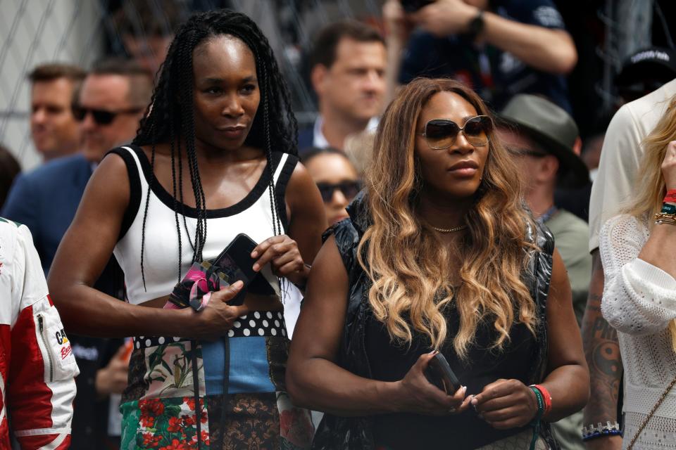 MIAMI, FLORIDA - MAY 07: Venus Williams and Serena Williams watch the grid presentation prior to the F1 Grand Prix of Miami at Miami International Autodrome on May 07, 2023 in Miami, Florida.