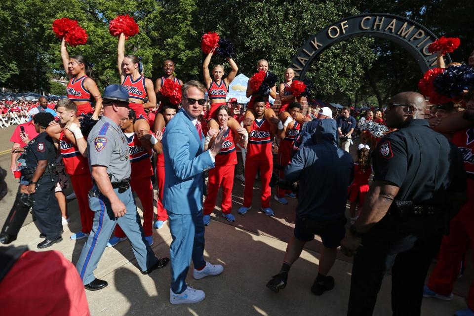 Sep 16, 2023; Oxford, Mississippi, USA; Mississippi Rebels head coach Lane Kiffin walks down the Walk of Champions prior to the game against the Georgia Tech Yellow Jackets at Vaught-Hemingway Stadium. Mandatory Credit: Petre Thomas-USA TODAY Sports