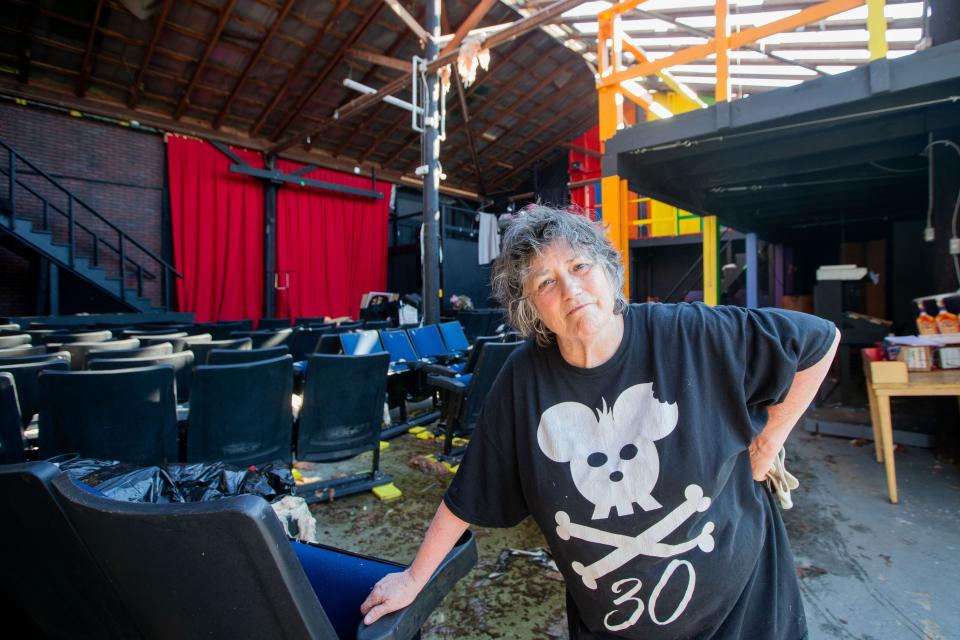 Terry Galloway, co-founder artistic director at Mickee Faust, stands inside what is left of the Mickee Faust venue a week after tornadoes tore through Tallahassee.