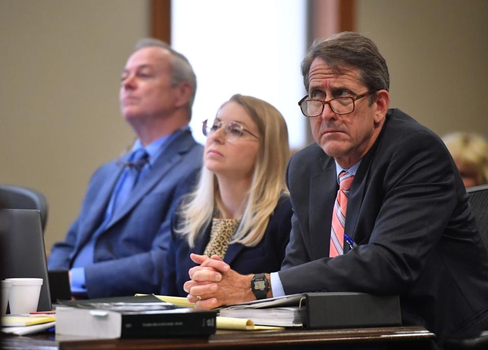 Michael Barfield, left, sits with Kaylin Humerickhouse and Morgan Bentley, representing The Florida Center for Government Accountability, as they listen to testimony during a hearing Thursday in front of Judge Hunter Carroll. Christian and Bridget Ziegler filed suit against the City of Sarasota, Sarasota Police Department and the 12th Judicial Circuit State Attorney's Office to stop the release of records obtained during closed criminal investigations into video voyeurism and sexual battery by Christian Ziegler. Ziegler was not charged in either case.