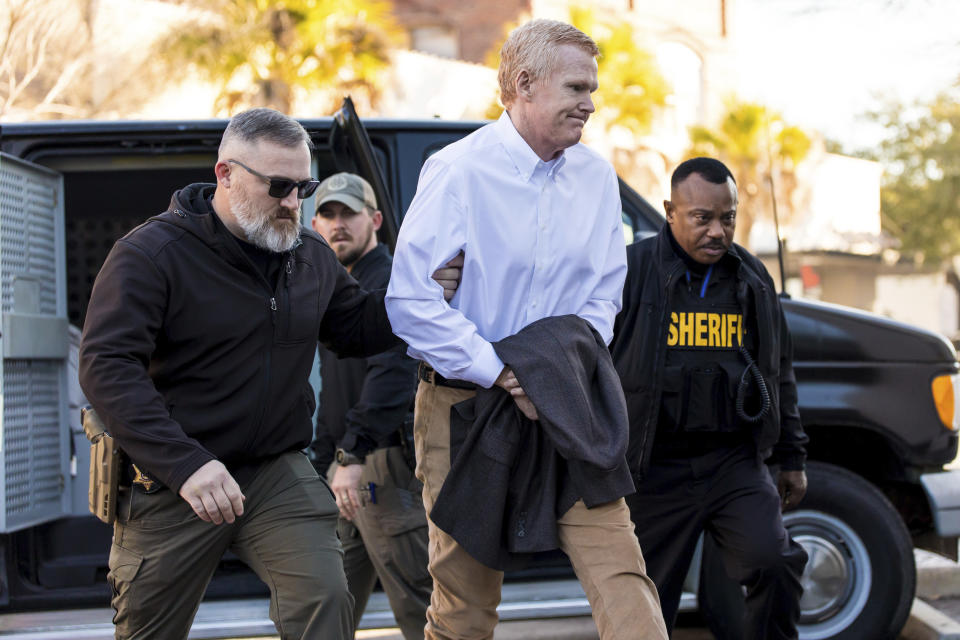 Alex Murdaugh, center, is escorted into the Colleton County Courthouse before his double murder trial in Walterboro, S.C., on Monday, Feb. 6, 2023. (Jeff Blake/The State via AP, Pool)