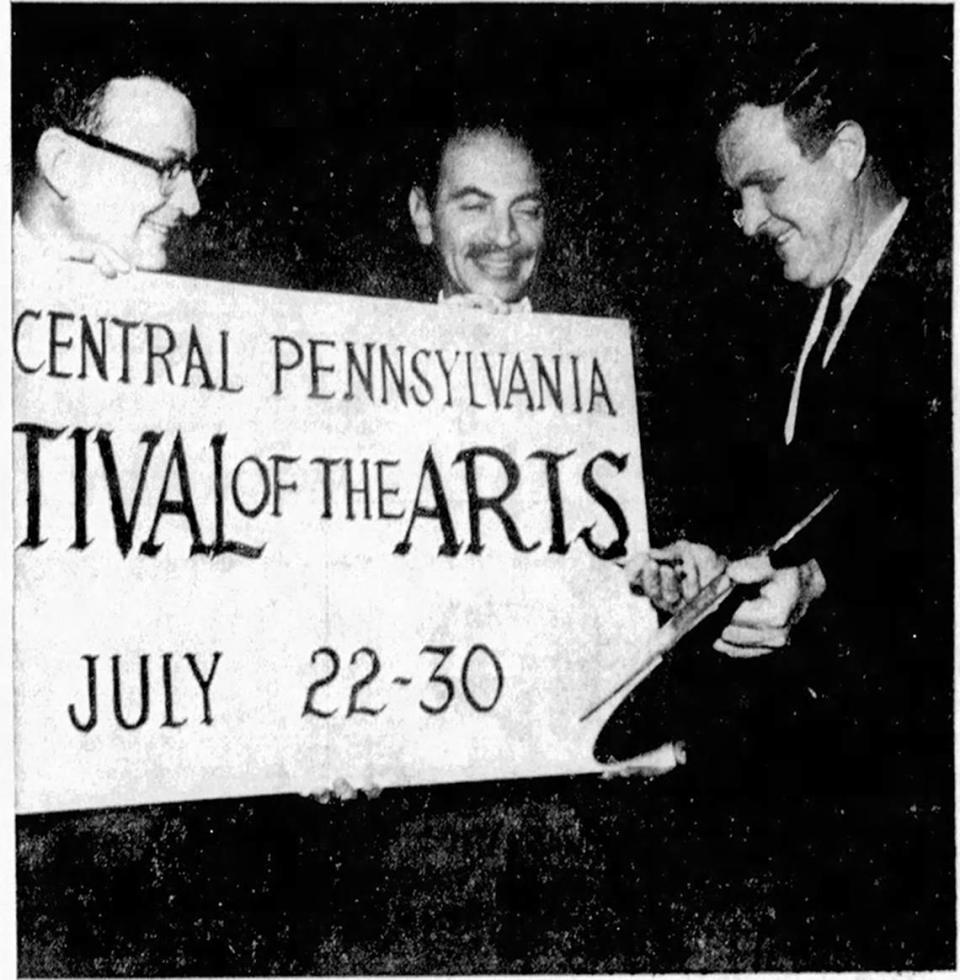 In this photo from May 1967, Gov. Raymond Shafer helps complete a sign announcing the Central Pennsylvania Festival of the Arts. Acknowledging his support are, from left, Wallis Lloyd, State College Area Chamber of Commerce president and festival co-chairman, and Jules Heller, dean of the Penn State College of Arts and Architecture and festival chairman.