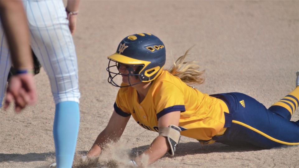Alexis Shepherd slides back into first base during an MHSAA district softball matchup between Gaylord and Petoskey on Tuesday, May 30 in Gaylord, Mich.