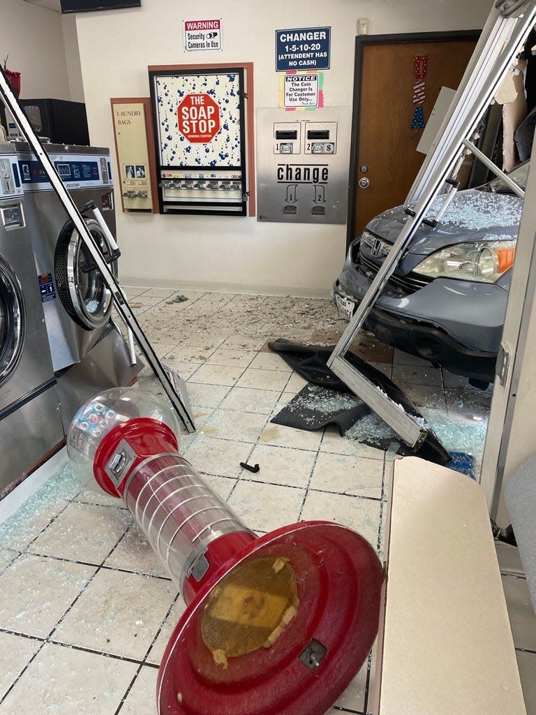 The front end of a vehicle is shown inside a Lower Valley laundromat. An elderly customer reportedly hit the gas pedal instead of the brake pedal and crashed into Laundry USA, 850 N. Carolina Drive, Space 1, in the Lower Valley at 12:55 p.m. Wednesday.