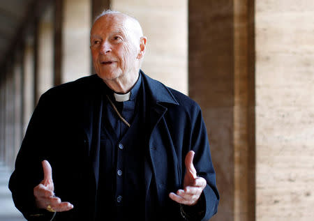FILE PHOTO: Cardinal Theodore Edgar McCarrick smiles during an interview with Reuters at the North American College at the Vatican February 14, 2013. REUTERS/Alessandro Bianchi/File Photo