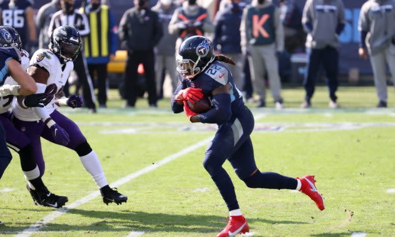 Running back Derrick Henry #22 of the Tennessee Titans carries the ball for yardage during the second half of their AFC Wild Card Playoff game against the Baltimore Ravens