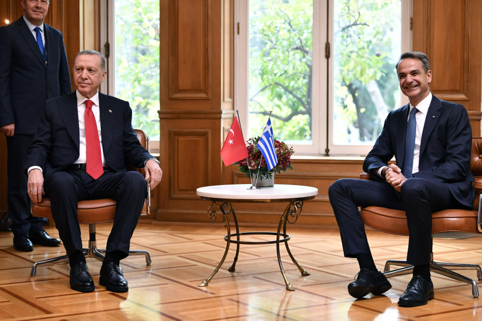 Greece's Prime Minister Kyriakos Mitsotakis, right, smiles during a meeting with Turkey's President Recep Tayyip Erdogan at Maximos Mansion in Athens, Greece, Thursday, Dec. 7, 2023. Erdogan arrived in Greece on a visit designed to set the historically uneasy neighbors on a more constructive path and help repair strained his country's strained relationship with the European Union. (AP Photo/Michael Varaklas)