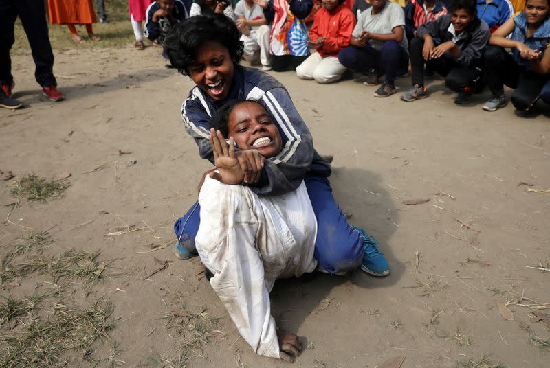 Girl practices a self-defense technique at a training camp in Kolkata