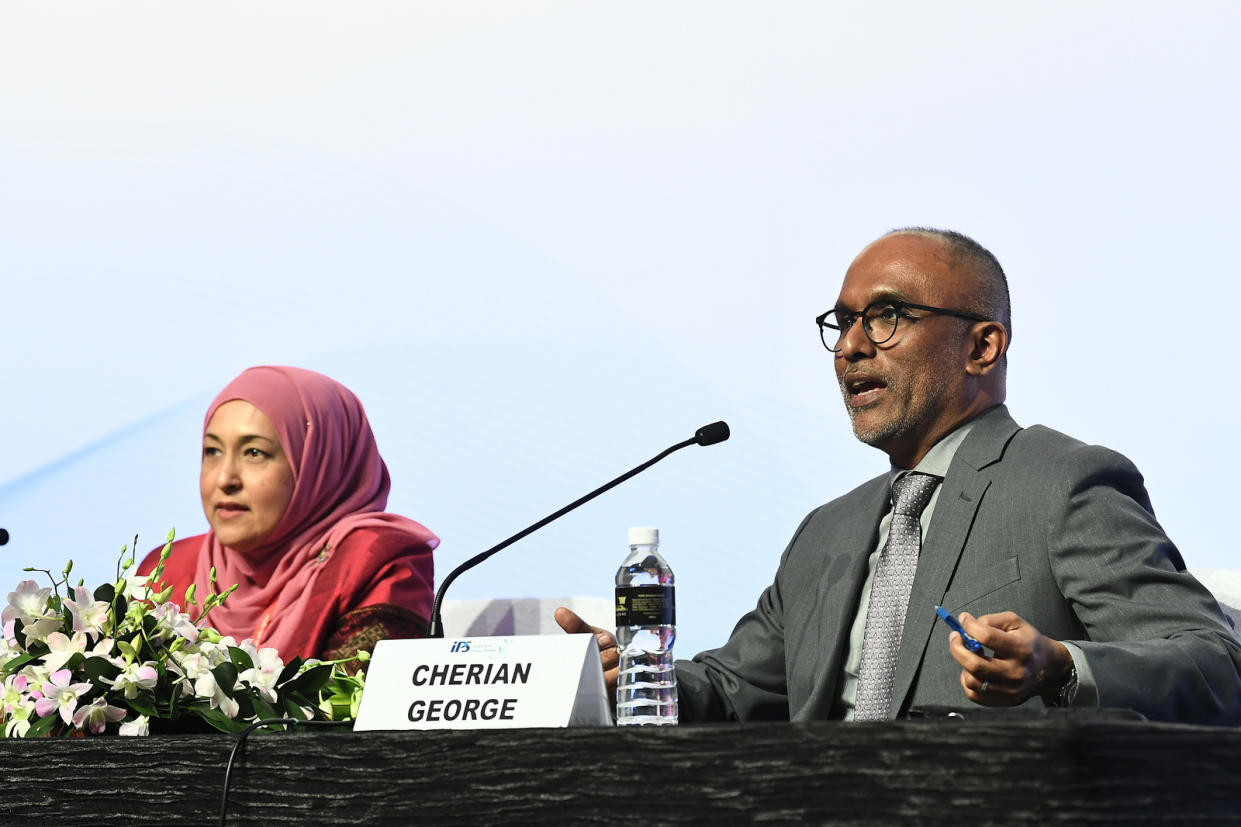 File photo of Hong Kong Baptist University media professor Cherian George (right) speaking at a conference to mark the 30th anniversary of the Institute of Policy Studies in October 2018.