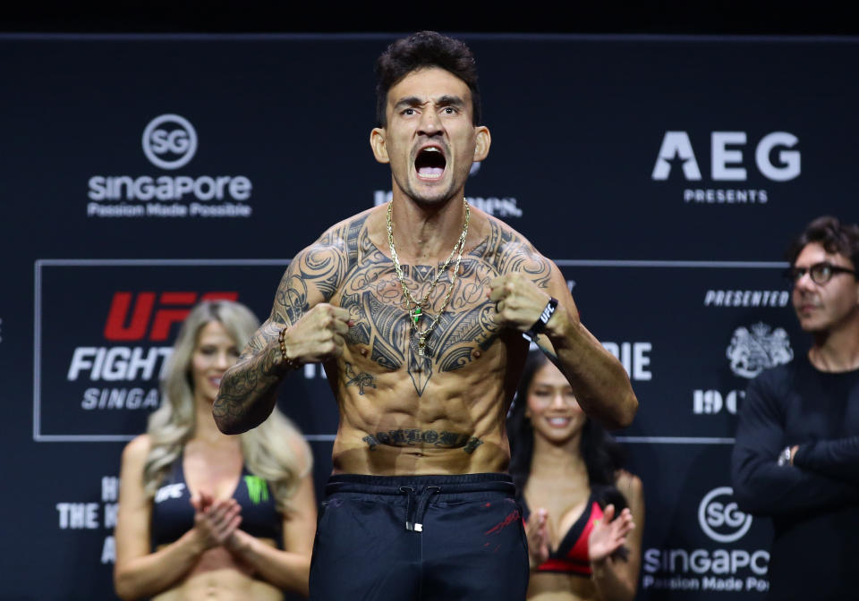 SINGAPORE, SINGAPORE - AUGUST 25: Max Holloway poses on the scale during the UFC Fight Night ceremonial weigh-in at Singapore Indoor Stadium on August 25, 2023 in Singapore. (Photo by Suhaimi Abdullah/Zuffa LLC via Getty Images)