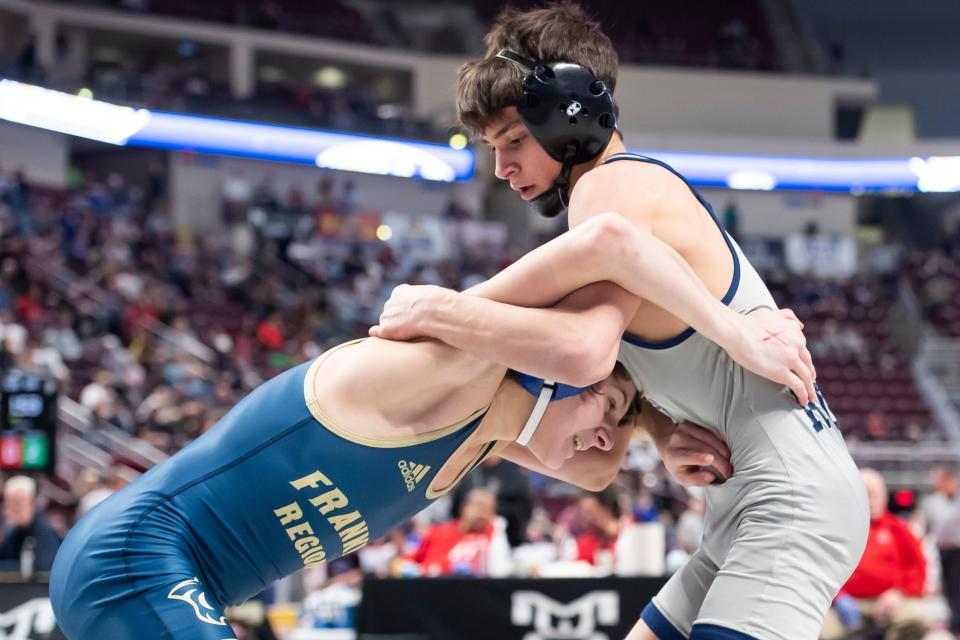 Council Rock North's Eren Sement, right, wrestles Franklin Regional's Tyler Kapusta during a 106-pound quarterfinal bout at the PIAA Class 3A Wrestling Championships at the Giant Center on Friday, March 11, 2022, in Derry Township.