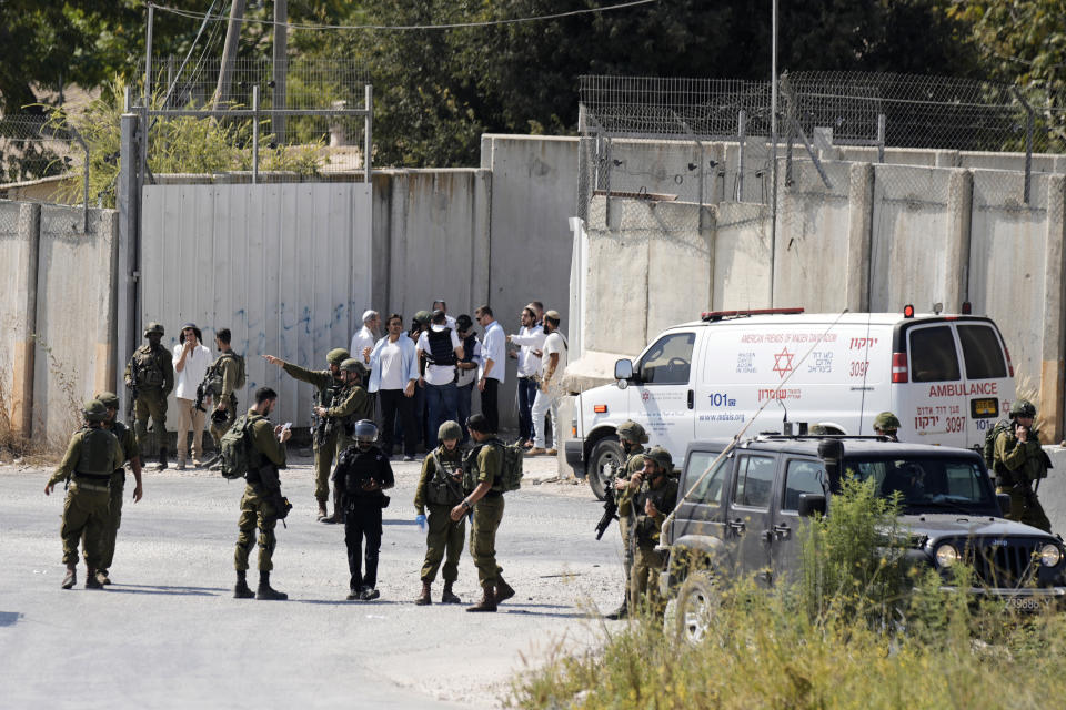 ADDS THAT THE SOLDIER DIED FROM HIS INJURIES - Israeli military forces work near the site where a soldier was killed by gunfire near the West Bank Jewish settlement of Shavei Shomron, Tuesday, Oct. 11, 2022. (AP Photo/ Majdi Mohammed)