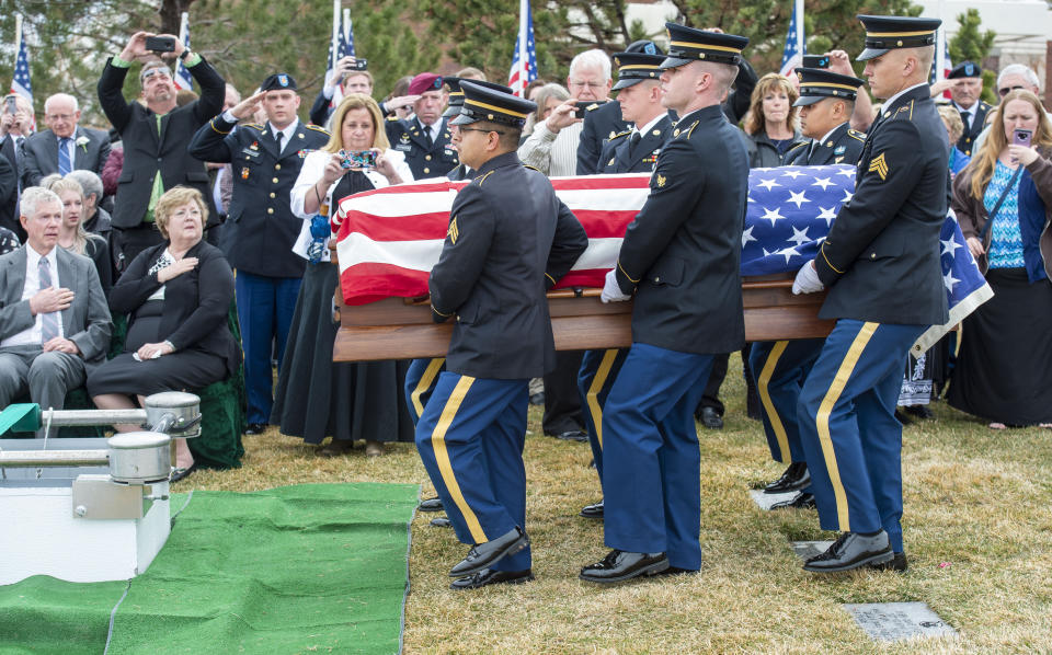The Honor Guard carries the casket of 2nd Lt. Lynn W. Hadfield during funeral services at Veterans Memorial Park in Bluffdale, Utah, Thursday, March 21, 2019. The Salt Lake City Tribune reported Thursday that Army Air Forces 2nd Lt. Lynn W. Hadfield's remains, returned from Germany, were buried 74 years to the day of Hadfield's crash during a bomber plane run from France to Germany just months before the war's end. (Rick Egan/The Salt Lake Tribune via AP)