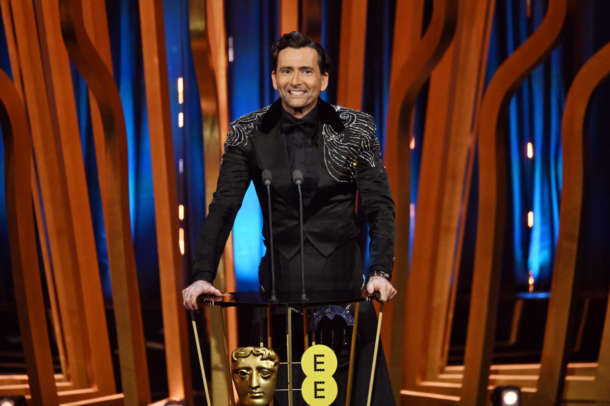 LONDON, ENGLAND - FEBRUARY 18: Host David Tennant on stage during the EE BAFTA Film Awards 2024 at The Royal Festival Hall on February 18, 2024 in London, England. (Photo by Kate Green/BAFTA/Getty Images for BAFTA)