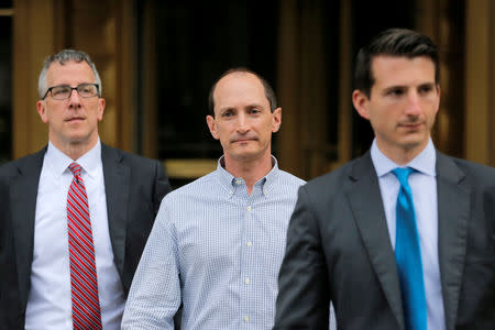 FILE PHOTO: Rob Olan (C), employee of the healthcare investment fund Deerfield Management, departs Federal Court in Manhattan after an arraignment for insider trading in New York, U.S., May 24, 2017. REUTERS/Lucas Jackson/File Photo