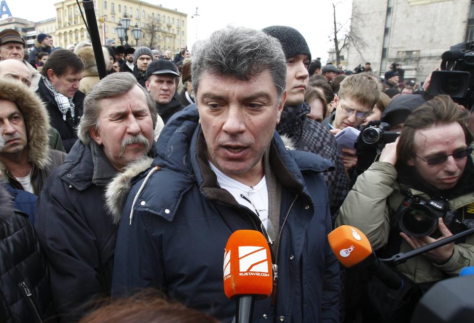 Opposition leader Boris Nemtsov speaks to the media during a gathering of opposition supporters in central Moscow March 17, 2012. The Russian opposition politician and former deputy prime minister Boris Nemtsov has been shot and killed by four shots in central Moscow, the Russian government said in a statement, according to the Interfax news agency. Picture taken March 17, 2012. REUTERS/Mikhail Voskresensky/Files (RUSSIA - Tags: POLITICS CIVIL UNREST)