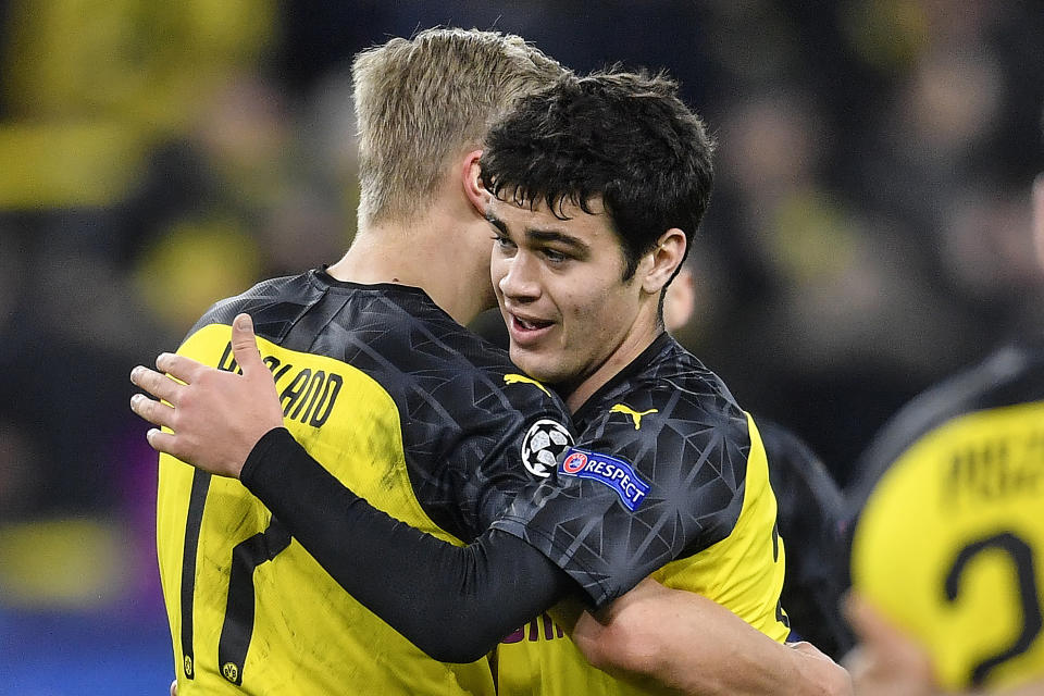 FILE - In this Feb. 18, 2020, file photo, Dortmund's Giovanni Reyna, right, embraces teammate Erling Braut Haaland after the Champions League round of 16 first leg soccer match against Paris Saint Germain in Dortmund, GermanyFeb. 18, 2020, file photo. Gio Reyna, a son of former U.S. captain Claudio Reyna, got his first call-up to the U.S. national soccer team. The Borussia Dortmund midfielder is part of a 24-man roster for exhibitions at Wales on Nov. 12 and against Panama four days later in Austria. (AP Photo/Martin Meissner, File)