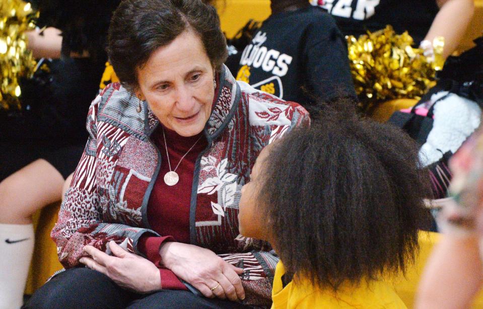 Sister of St. Joseph Linda Fusco, 73, left, talks with a student at Blessed Sacrament School, where Fusco serves as a math specialist, during a pep rally in Erie on Feb. 15, 2024.