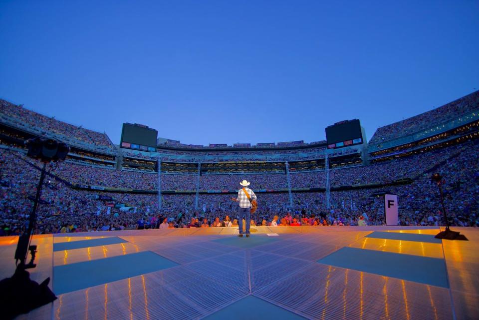 Mitch Rossell, shown performing as the opening act for Garth Brooks, returns to Canton Township on May 13 for a concert at Canton South High School.