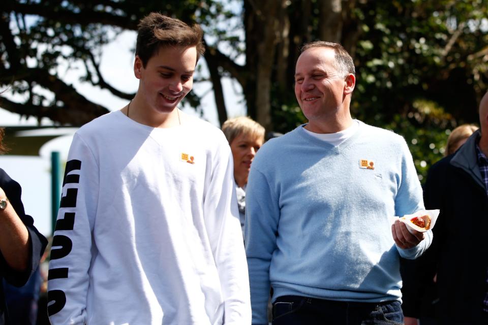 New Zealand Prime Minister John Key and son Max Key chat after voting at the Parnell District School on September 20, 2014, in Auckland, New Zealand.