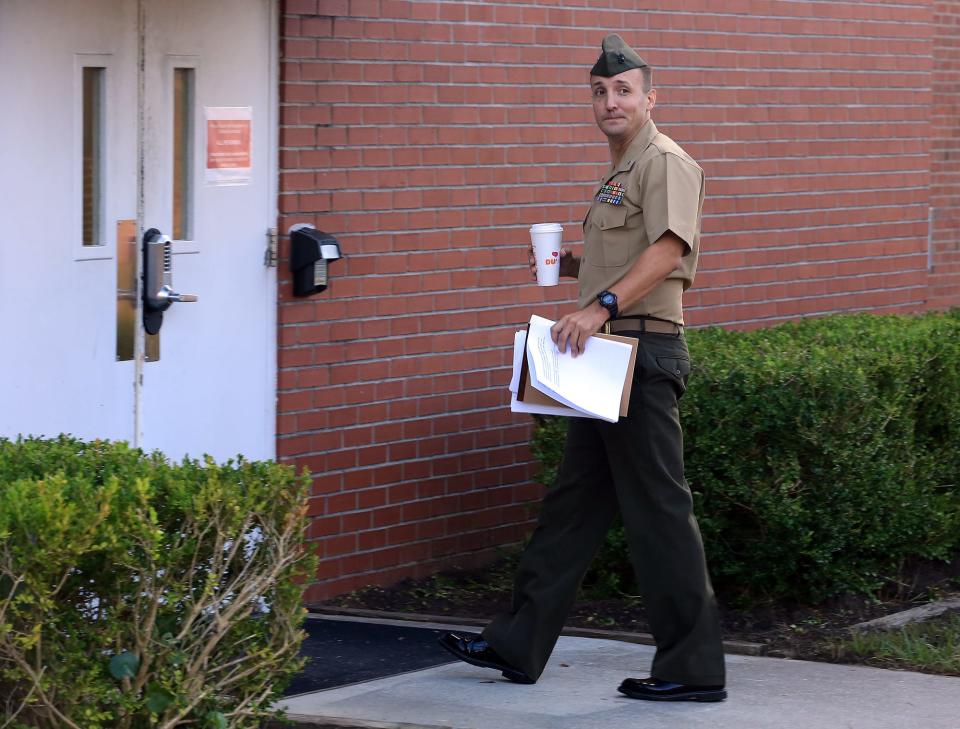 Marine Lt. Col. Stuart Scheller Jr. walks to his court-martial on Friday Oct.15, 2021, at Camp Lejeune NC. He was sentenced that morning to lose $5,000 of pay and receive a letter of reprimand for publicly criticizing US military leadership for how the American withdrawal from Afghanistan played out.