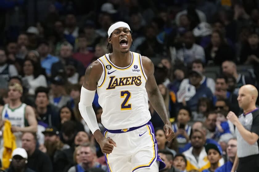 Los Angeles Lakers forward Jarred Vanderbilt (2) reacts after scoring during the second half of an NBA basketball game against the Dallas Mavericks in Dallas, Sunday, Feb. 26, 2023. (AP Photo/LM Otero)