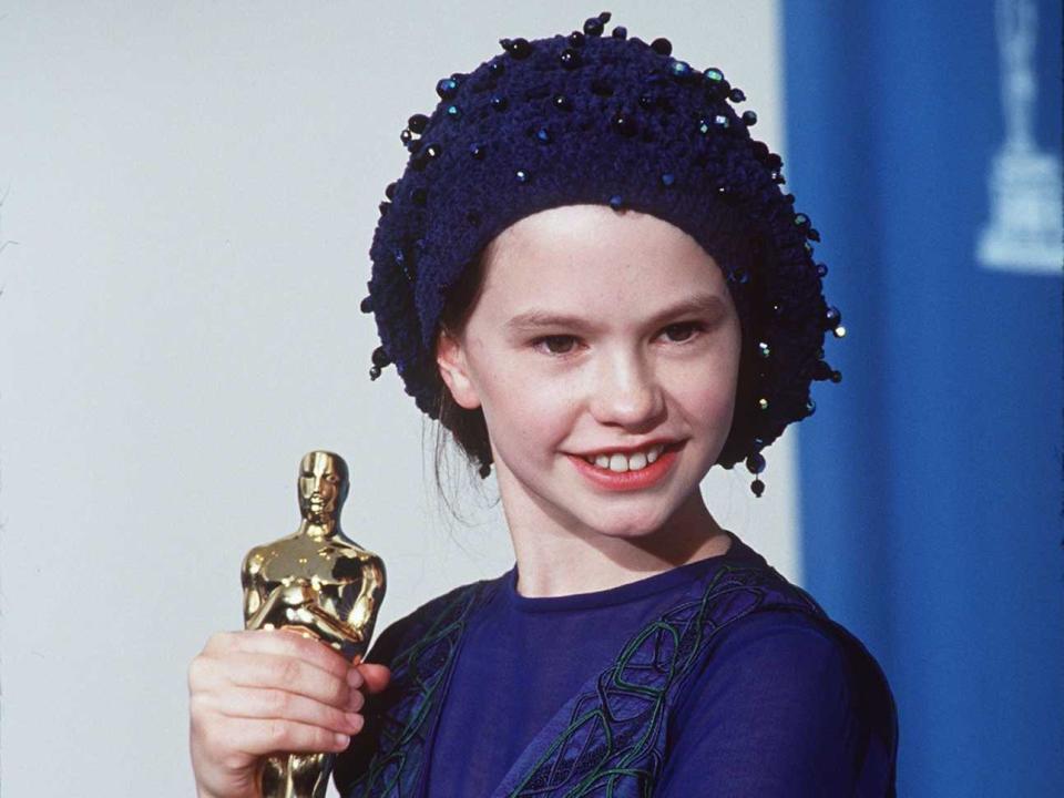 Anna Paquin holds an Oscar in 1994