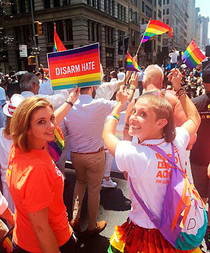 <p>Watts walking with her daughter in the 2016 N.Y.C. Pride parade.</p>