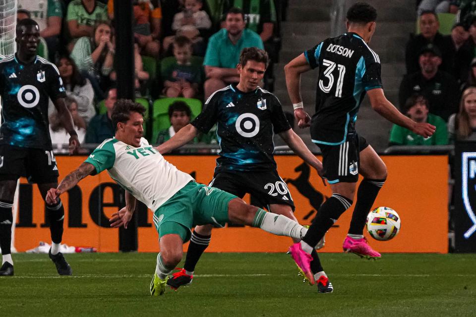 Austin FC's Guilherme Biro attempts to steal the ball from Minnesota United FC midfielder Hassani Dotson during their season-opening match Saturday night at Q2 Stadium. El Tree lost 2-1.
