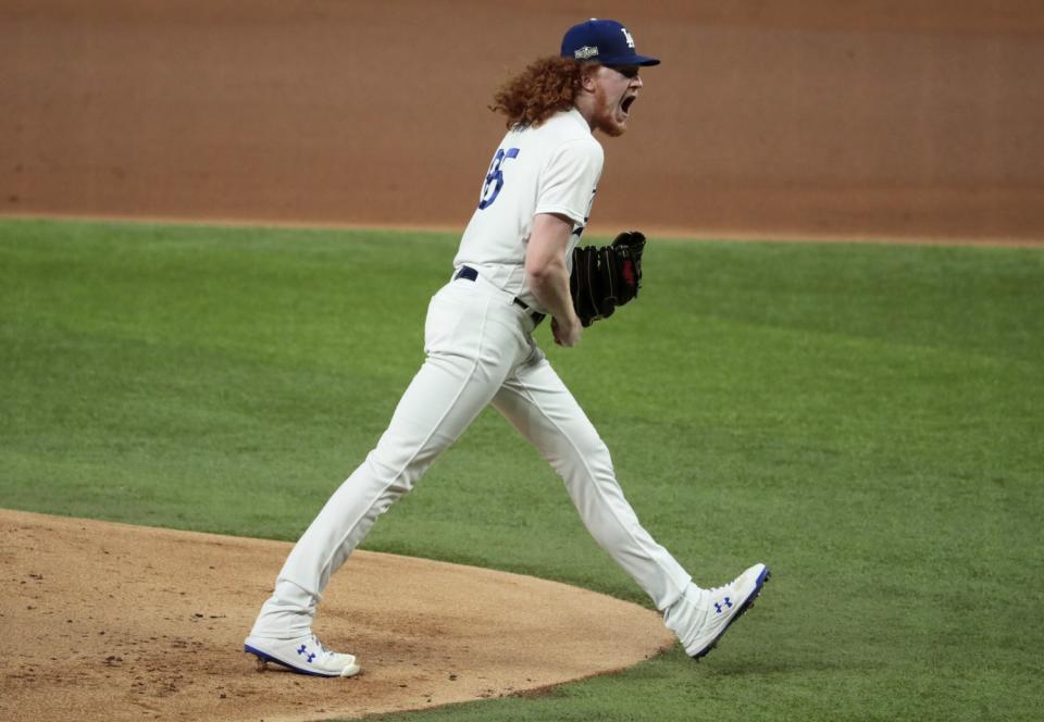 Dodgers starter Dustin May yells out after striking out Ozzie Albies.