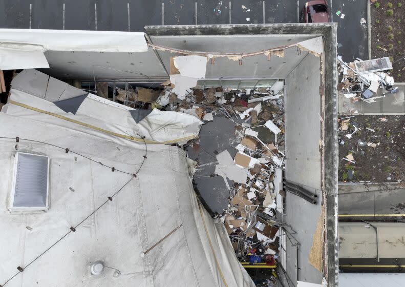 A drone image of a collapsed roof at a Peet's Coffee distribution center in Oakland on Friday.