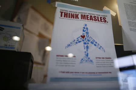 A measles poster is seen at Venice Family Clinic in Los Angeles, California February 5, 2015. REUTERS/Lucy Nicholson