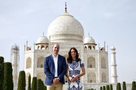 Britain's Prince William and his wife Catherine, the Duchess of Cambridge, pose in front of the Taj Mahal in Agra, April 16, 2016. REUTERS/Adnan Abidi