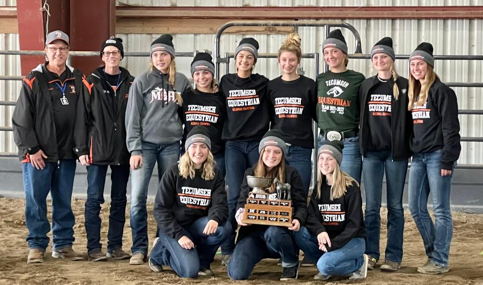 The Tecumseh equestrian team poses with their reserve state champions trophy after finishing second in Division A at the Michigan Interscholastic Horsemanship Association state finals at Midland in October.