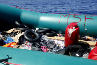 A rubber boat holds belongings left by African migrants after being rescued by the MV Geo Barents vessel of MSF (Doctors Without Borders), off Libya in the central Mediterranean route, Monday, Sept. 20, 2021. (AP Photo/Ahmed Hatem)