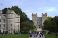 The Royal Standard flies above Windsor Castle, in Windsor, England, Friday, Oct. 22, 2021. Britain's Queen Elizabeth II spent a night in a hospital for checks this week after canceling an official trip to Northern Ireland on medical advice, Buckingham Palace said Thursday. The palace said the 95-year-old British monarch went to the private King Edward VII's Hospital in London on Wednesday for "preliminary investigations." It said she returned to her Windsor Castle home at lunchtime on Thursday, "and remains in good spirits."(AP Photo/Kirsty Wigglesworth)