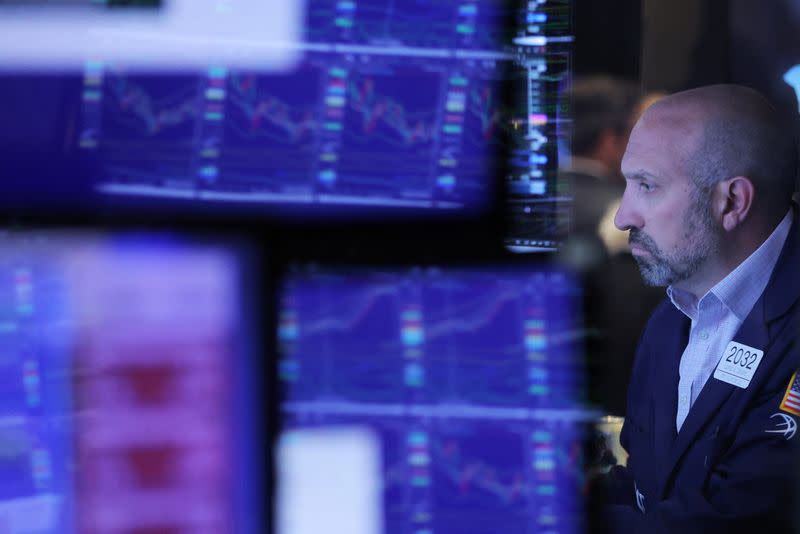 A trader works on the trading floor at the New York Stock Exchange (NYSE) in Manhattan, New York City