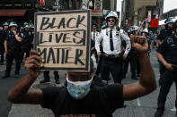 Police surround demonstrators in Times Square during a protest march, June 4, 2020, in New York. The image was part of a series of photographs by The Associated Press that won the 2021 Pulitzer Prize for breaking news photography. (AP Photo/John Minchillo)