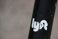 The Lyft logo is seen on a parked Lyft Scooter in Washington