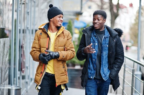 <span class="caption">Experiencing skin-shade prejudice can impact on a person's self-confidence and their relationships.</span> <span class="attribution"><a class="link " href="https://www.shutterstock.com/image-photo/two-african-male-friends-talking-together-1616496982" rel="nofollow noopener" target="_blank" data-ylk="slk:AS photostudio | Shutterstock;elm:context_link;itc:0;sec:content-canvas">AS photostudio | Shutterstock</a></span>