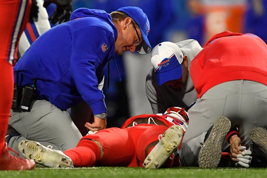Buffalo Bills running back Damien Harris is attended to by medical staff after taking a hard hit against the New York Giants during the first half of an NFL football game in Orchard Park, N.Y., Sunday, Oct. 15, 2023. (AP Photo/Adrian Kraus)