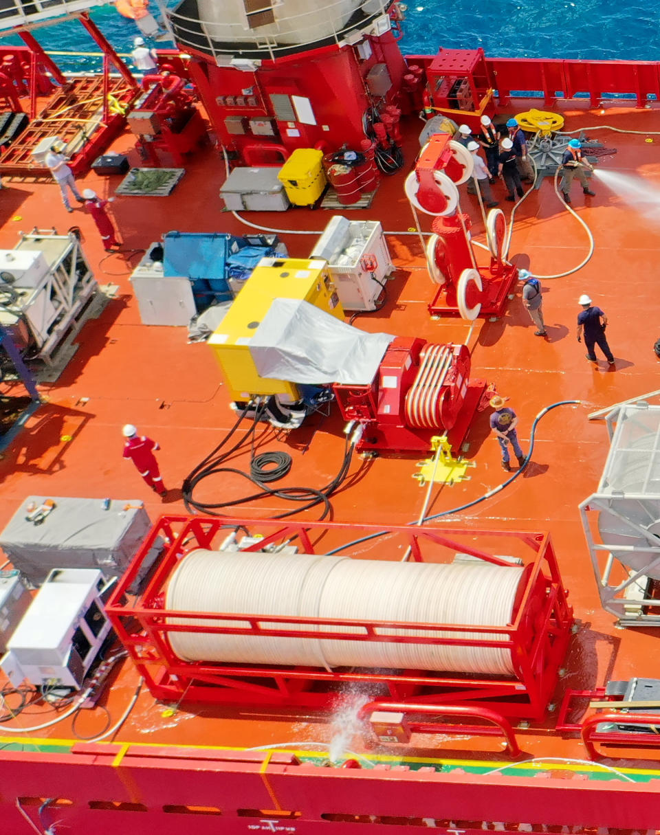 Components of a Flyaway Deep Ocean Salvage System, or FADOSS, rest on the deck of a vessel in this undated photo provided by the U.S. Navy Office of Information. The U.S. Navy said Sunday, June 25, 2023, that it won't be using a Flyaway Deep Ocean Salvage System it had deployed to the effort to retrieve the Titan submersible. The Navy would only use the system if there were pieces large enough to require the specialized equipment. The submersible imploded on its way to tour the Titanic wreckage, killing all five on board. (U.S. Navy Office of Information via AP)
