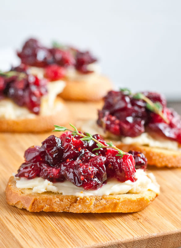<p>Neighbor Food</p><p>Sticky sweet cranberries and brie offset the piney rosemary in a way that just screams Christmas time, and the gorgeous colors make them absolutely perfect for party trays. </p><p><strong>Get the recipe: <a href="https://neighborfoodblog.com/cranberry-brie-crostini/" rel="nofollow noopener" target="_blank" data-ylk="slk:Roasted Balsamic Cranberry and Brie Crostini;elm:context_link;itc:0;sec:content-canvas" class="link rapid-noclick-resp">Roasted Balsamic Cranberry and Brie Crostini</a></strong></p>