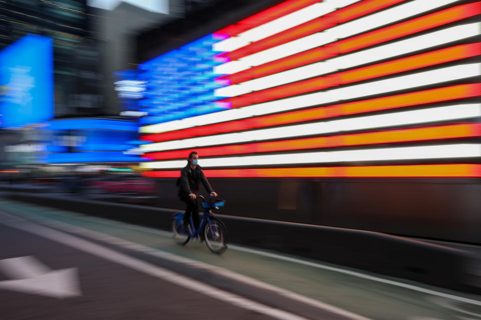 NEW YORK, USA - MARCH 25: A bicyclist is seen as large crowd of tourists visit the Times Square during COVID-19 pandemic in New York City, United States on March 25, 2021. (Photo by Tayfun Coskun/Anadolu Agency via Getty Images)