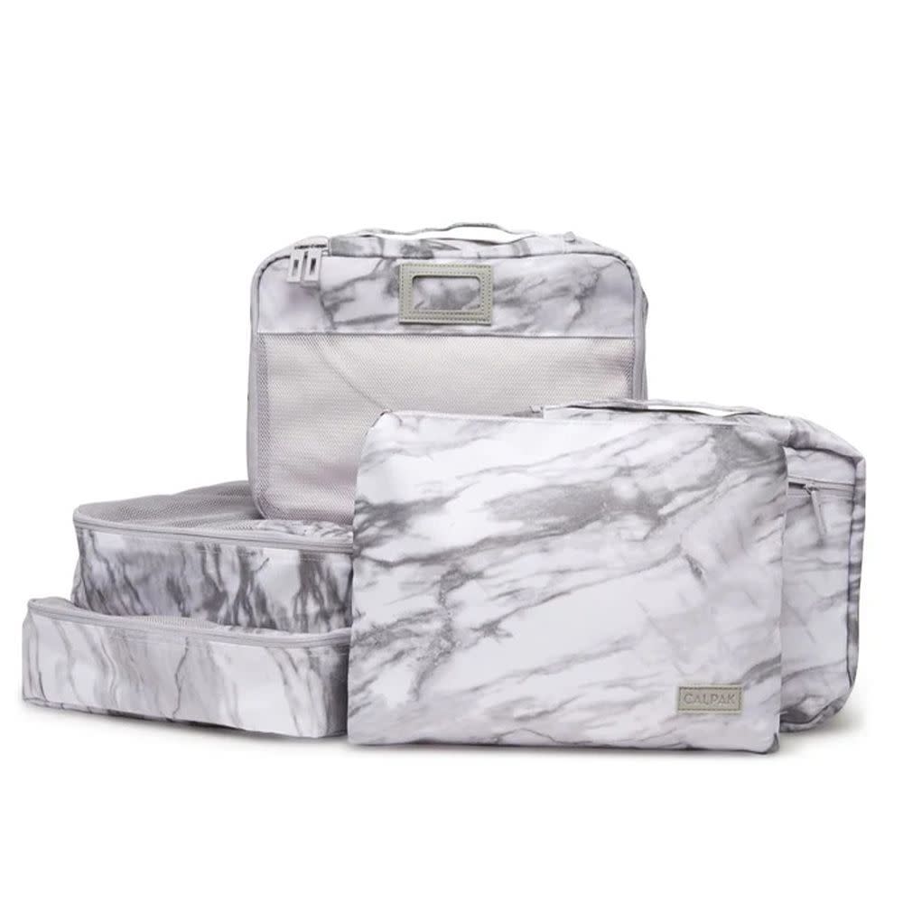 <p><a href="https://go.redirectingat.com?id=74968X1596630&url=https%3A%2F%2Fwww.calpaktravel.com%2Fproducts%2Fpacking-cubes-5-piece-set&sref=https%3A%2F%2F" rel="nofollow noopener" target="_blank" data-ylk="slk:Shop Now;elm:context_link;itc:0;sec:content-canvas" class="link rapid-noclick-resp">Shop Now</a></p><p>Packing Cubes Set (5 Pieces)</p><p>calpaktravel.com</p><p>$54.40</p><span class="copyright">Calpak</span>