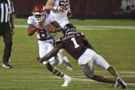 Mississippi State cornerback Martin Emerson (1) tackles Arkansas wide receiver Mike Woods (8) during the second half of an NCAA college football game in Starkville, Miss., Saturday, Oct. 3, 2020. Arkansas won 21-14. (AP Photo/Thomas Graning)